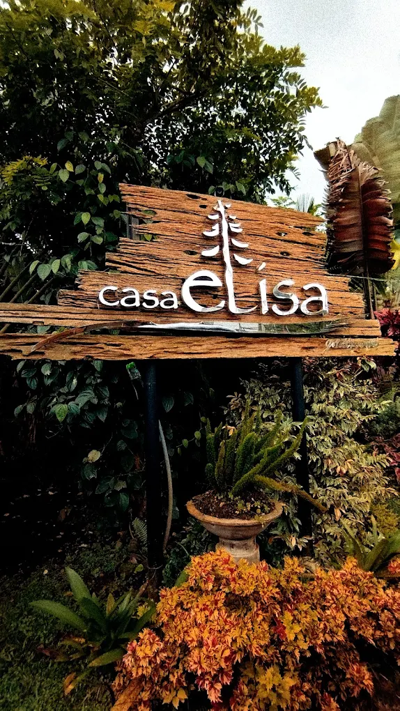 Casa Elisa sign amidst lush greenery and vibrant plants in Alfonso, Cavite.
