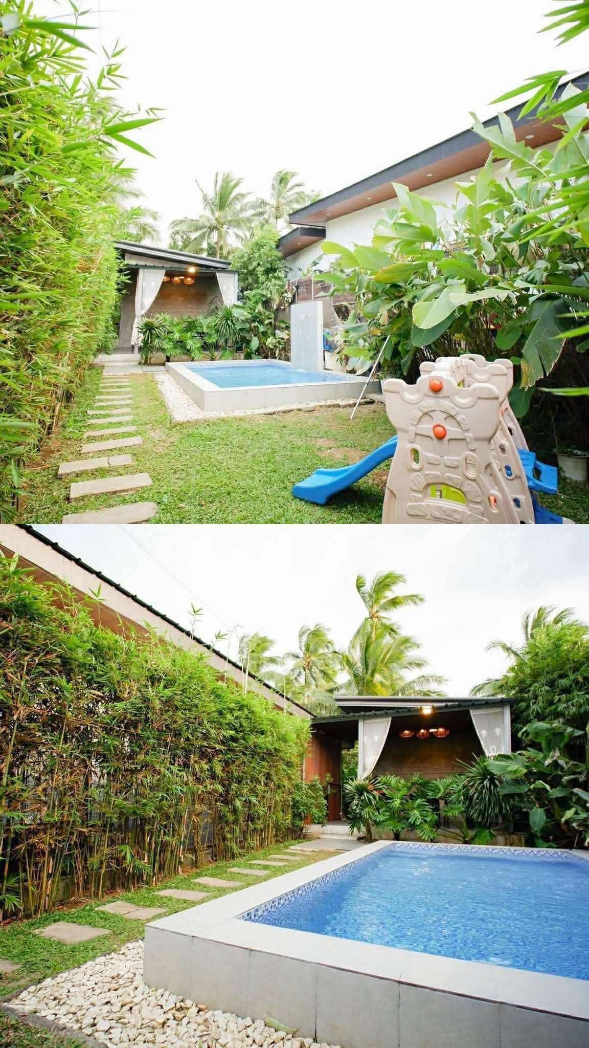 Lush garden with pool and play area at Sandrine Villa, Alfonso, surrounded by tropical plants and bamboo walkway.