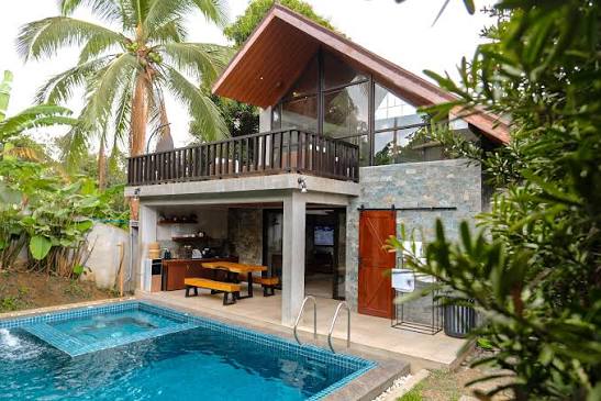 Modern villa with pool and tropical garden at ARQA Palm Villas, Alfonso, Cavite.