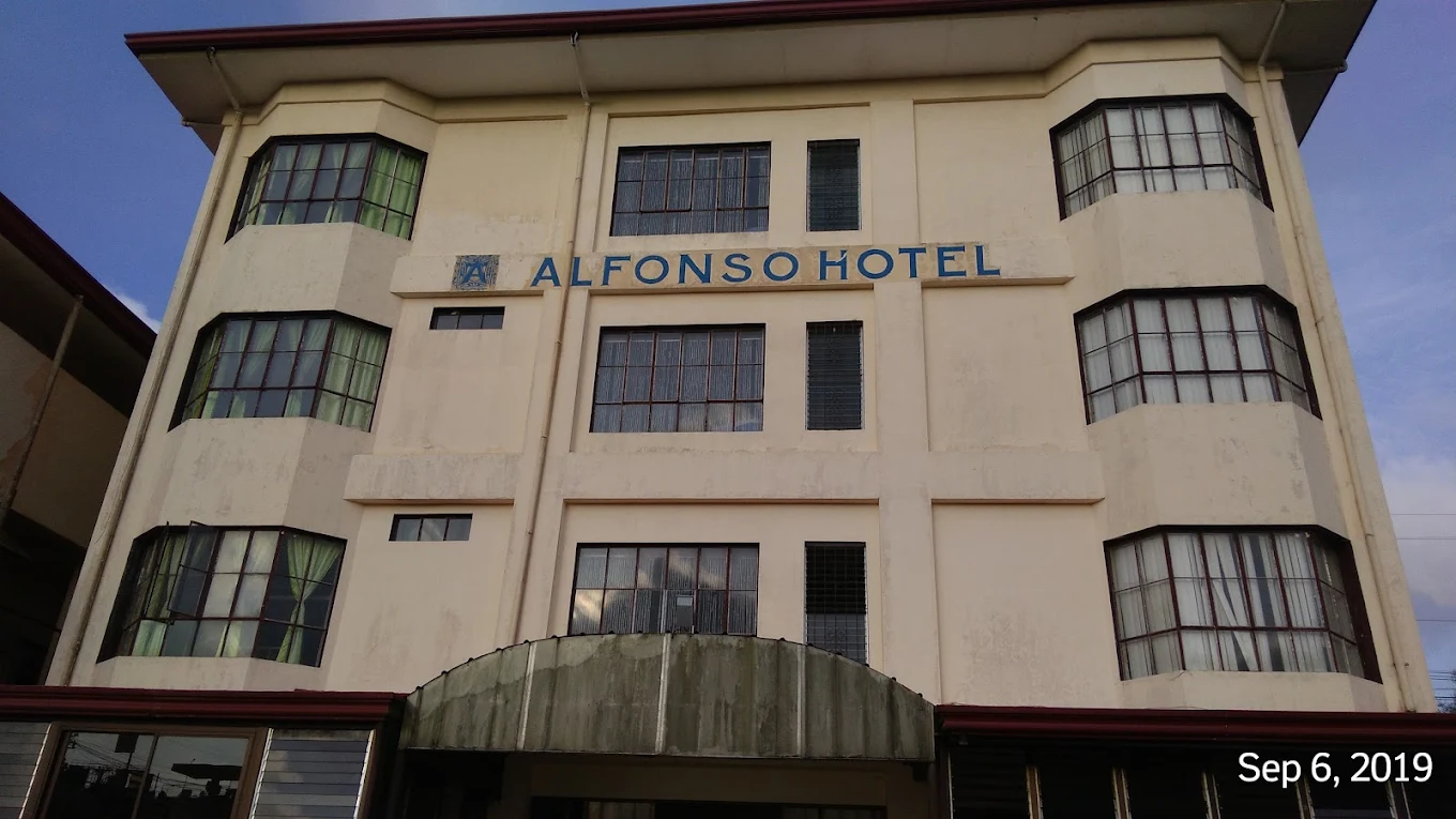Alfonso Hotel building facade with large windows in Alfonso, Cavite.
