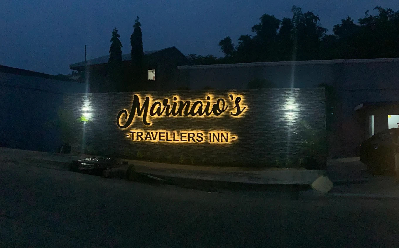 Marinaio's Traveller Inn illuminated sign at night, Trece Martires, Cavite.