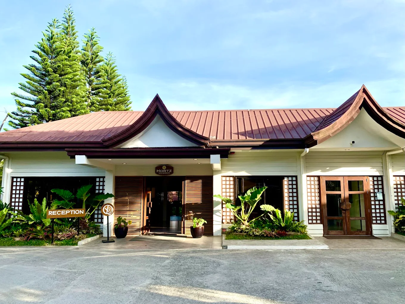 Hortz Hotels and Resorts entrance with lush greenery and traditional architecture in Tagaytay, Cavite.