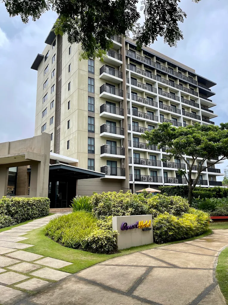 Quest Hotel Tagaytay building with lush greenery and a welcoming entrance in Tagaytay.