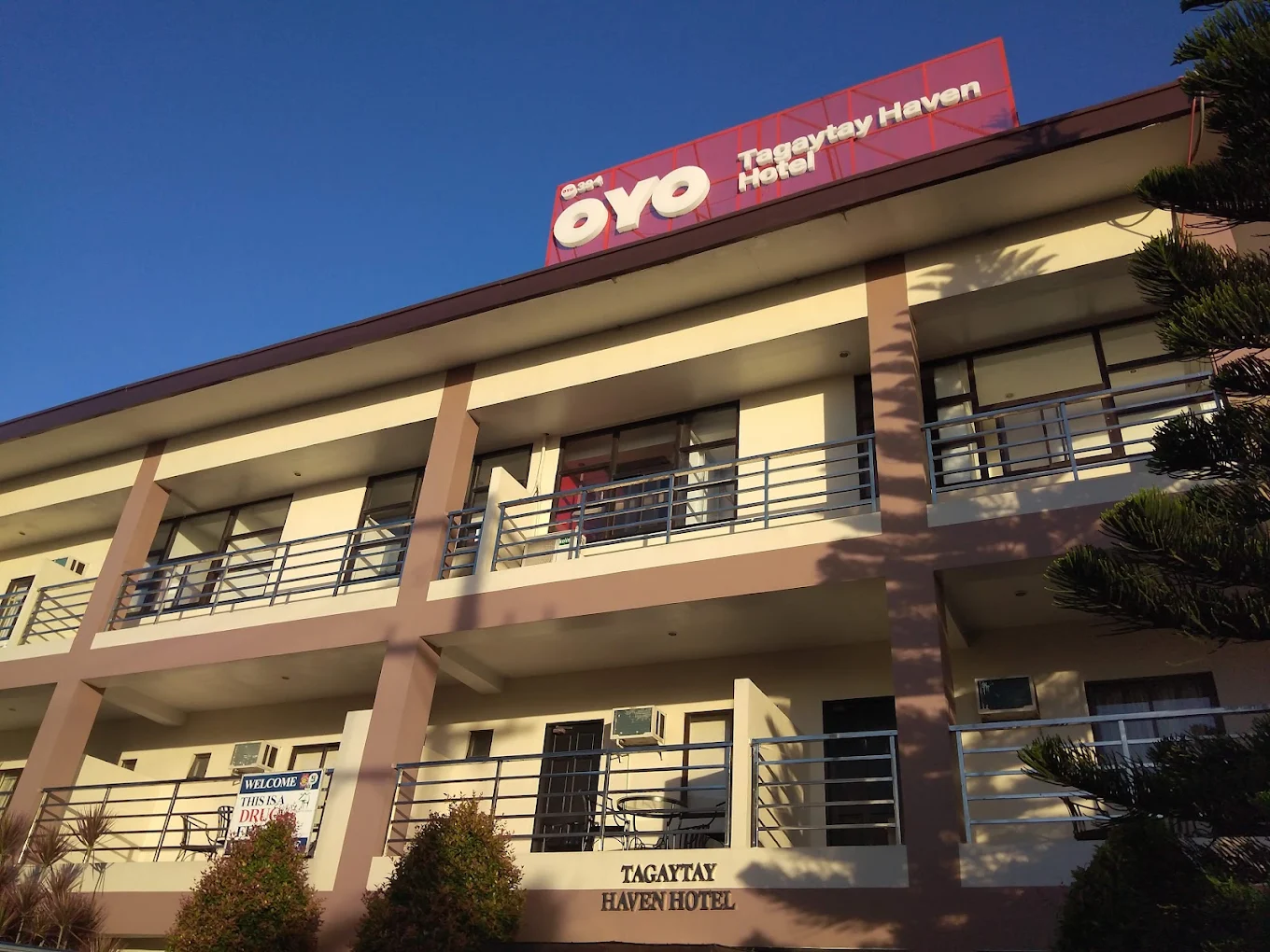 Tagaytay Haven Hotel Mendez facade with balconies and signage under a clear blue sky in Tagaytay.