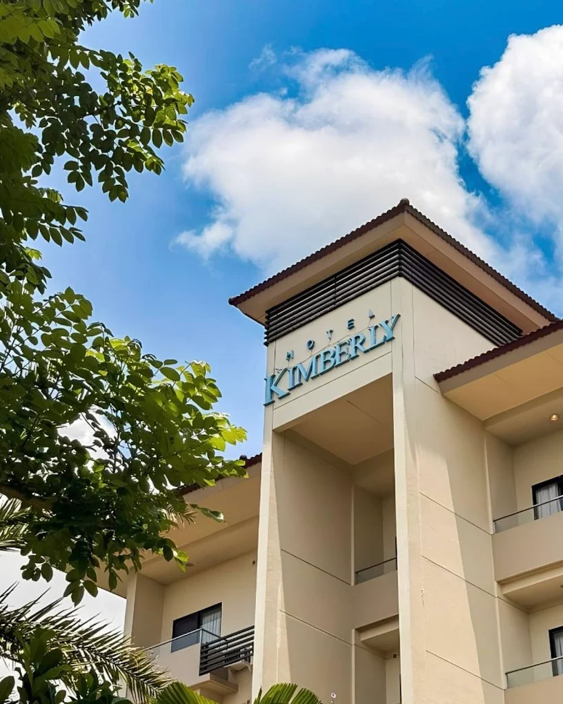 Hotel Kimberly Tagaytay building with clear blue sky and lush greenery in Tagaytay.