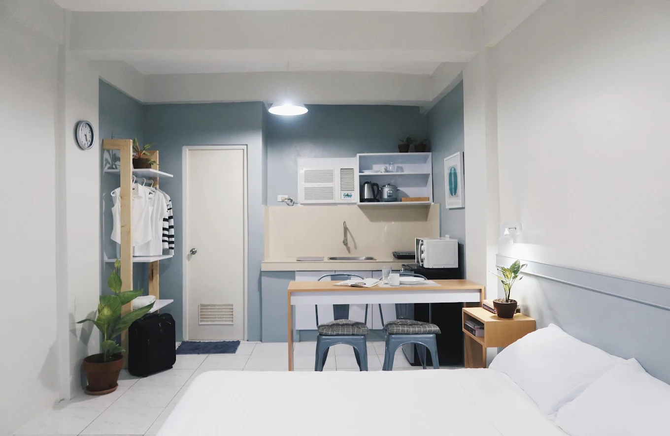 Cozy studio interior with kitchenette and bed at Dragonfly Apartments and Transient House, Bacoor.